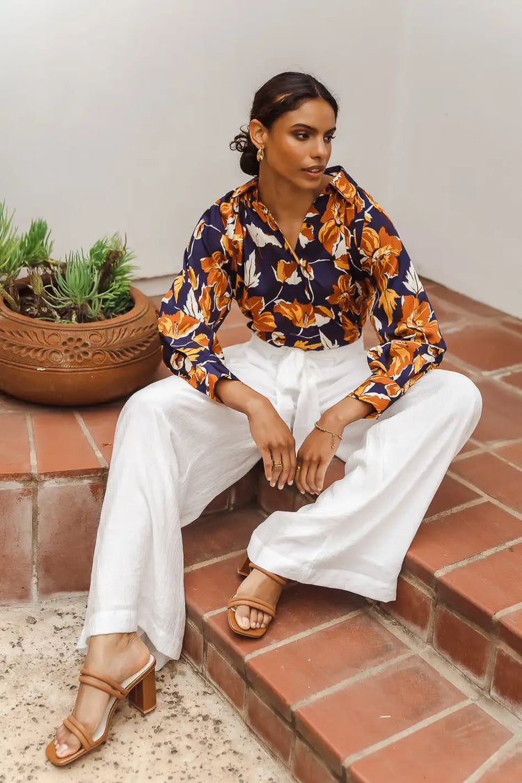 Wide leg pants paired with a floral blouse 