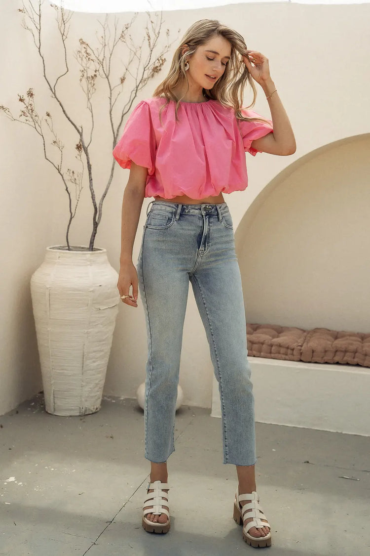 Crop top in pink paired with a light denim 