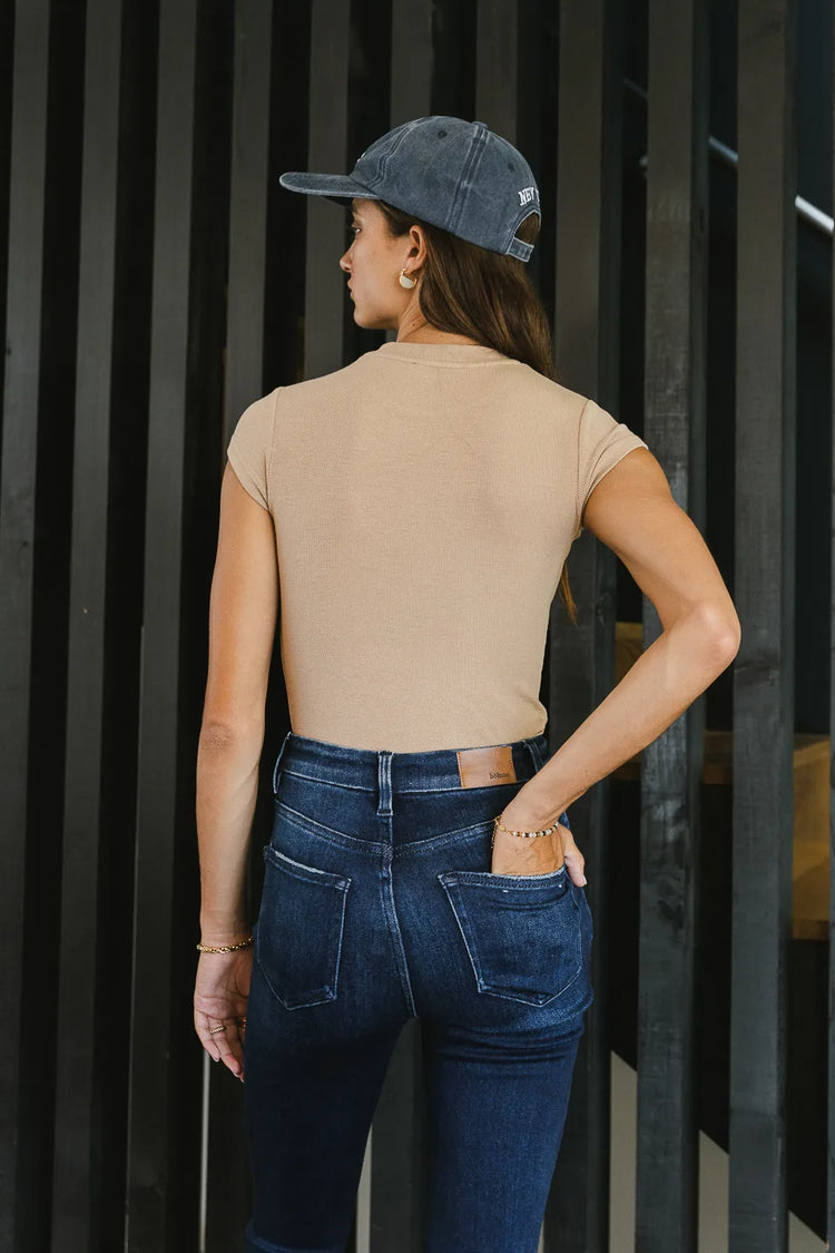 back side of short sleeve tan bodysuit 