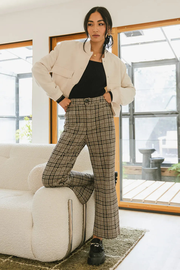 Plaid taupe pants paired with a cropped jacket 