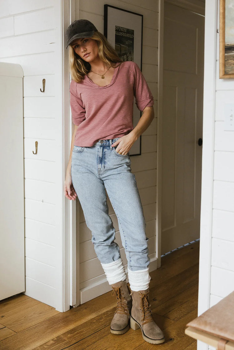 Top in pink paired with a light wash denim 