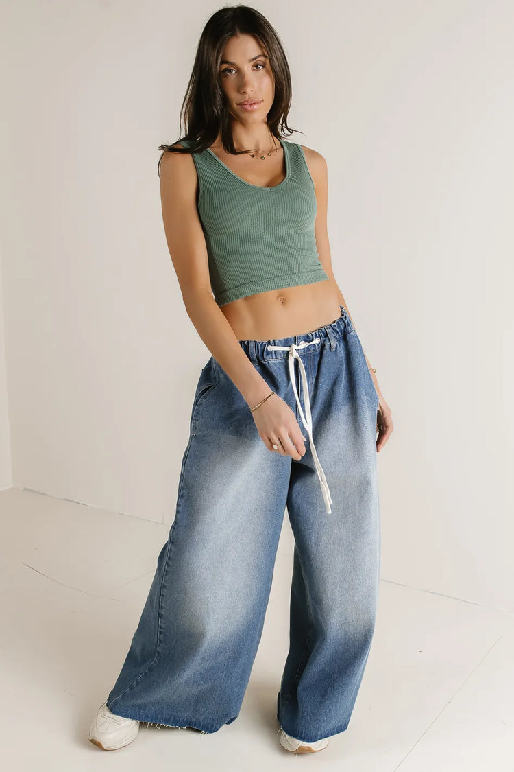 Tank top paired with a wide leg denim 