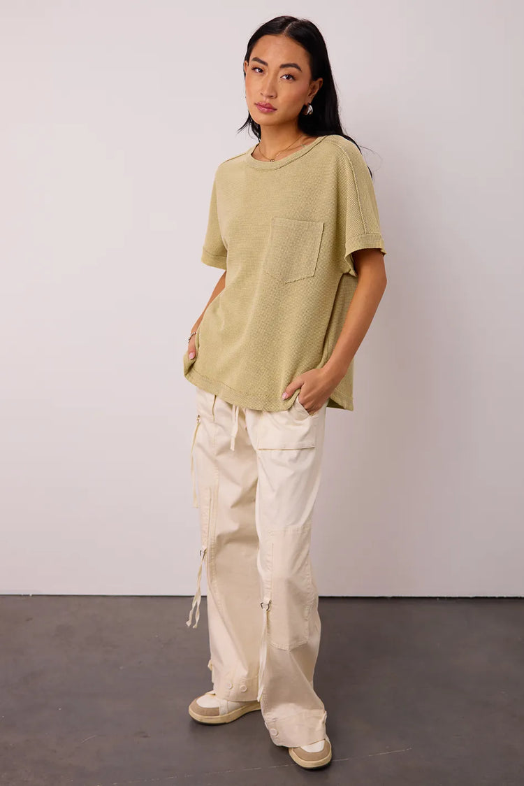 Waffle top in sage paired with a cargo cream pants 