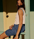 cropped vest in ivory with denim romper
