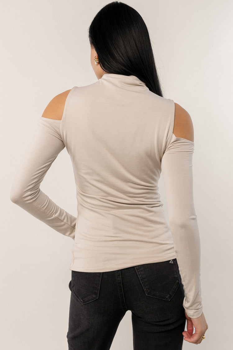 long sleeve cream top with shoulder cut outs
