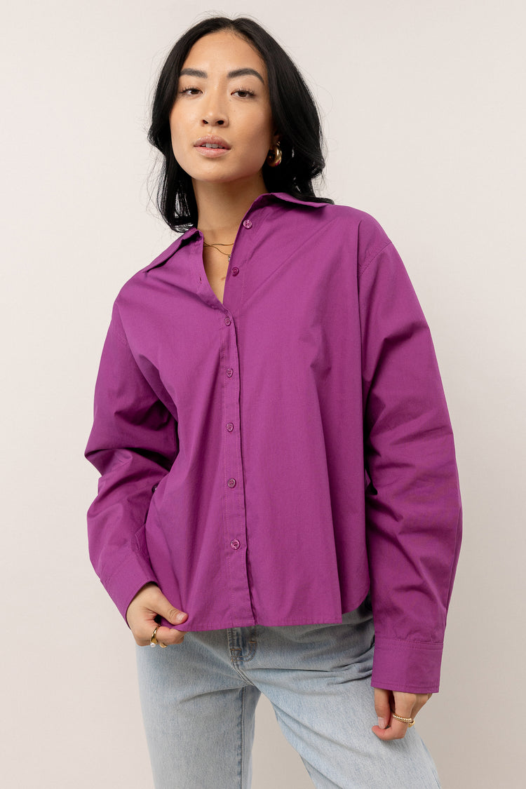 model wearing purple long sleeve button down