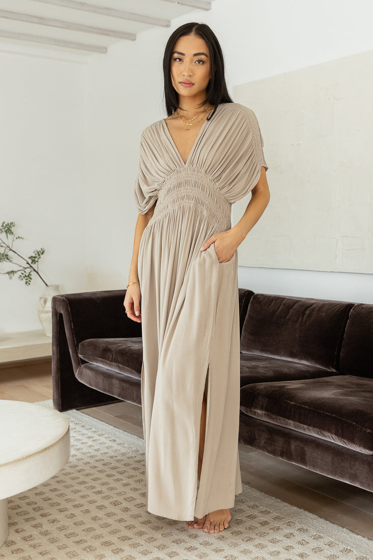 v neck maxi dress pared with gold jewelry 