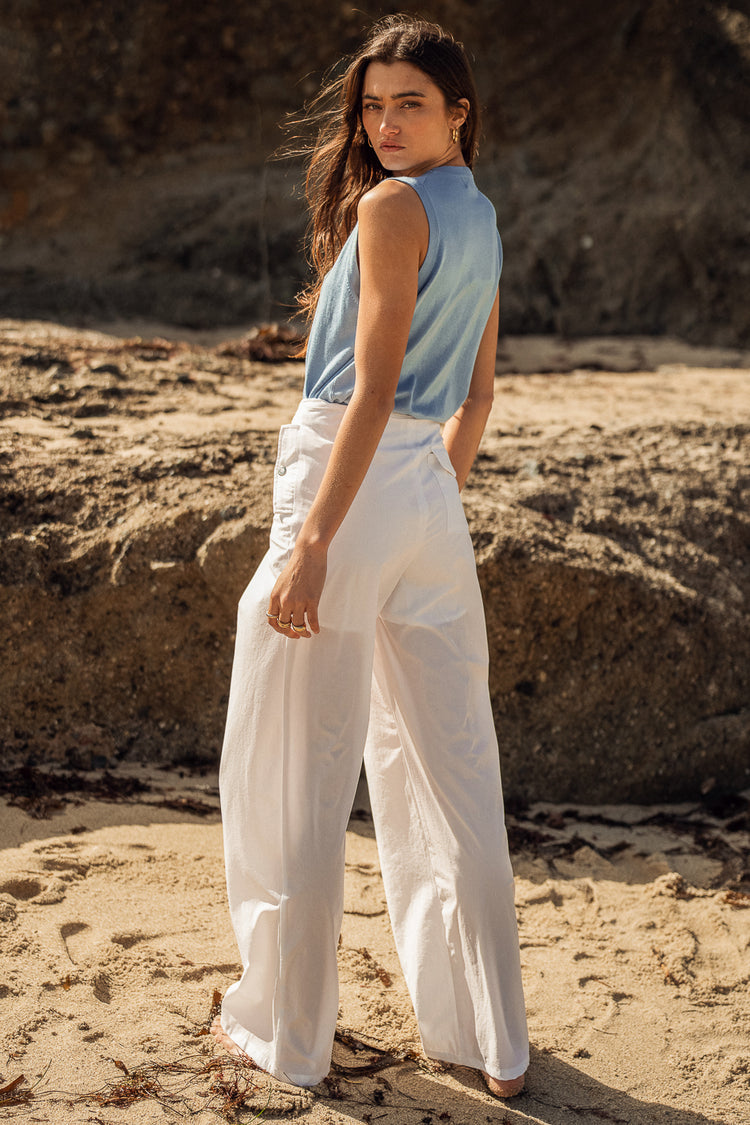 Pants in white paired with a blue top 