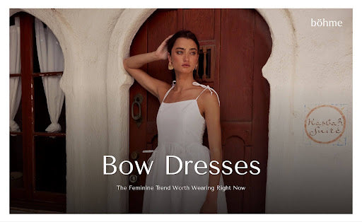 Woman wearing a white bow-strap midi dress.