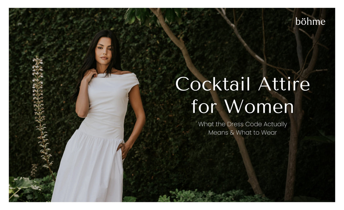 Woman in off-shoulder white midi dress standing against a green hedge