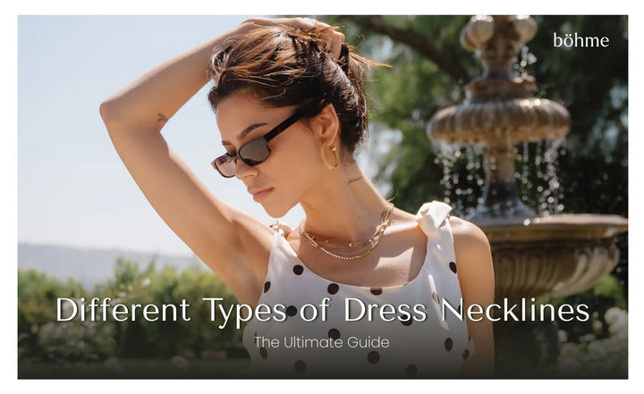 Woman in a white polka dot one-shoulder dress wearing sunglasses near an outdoor fountain