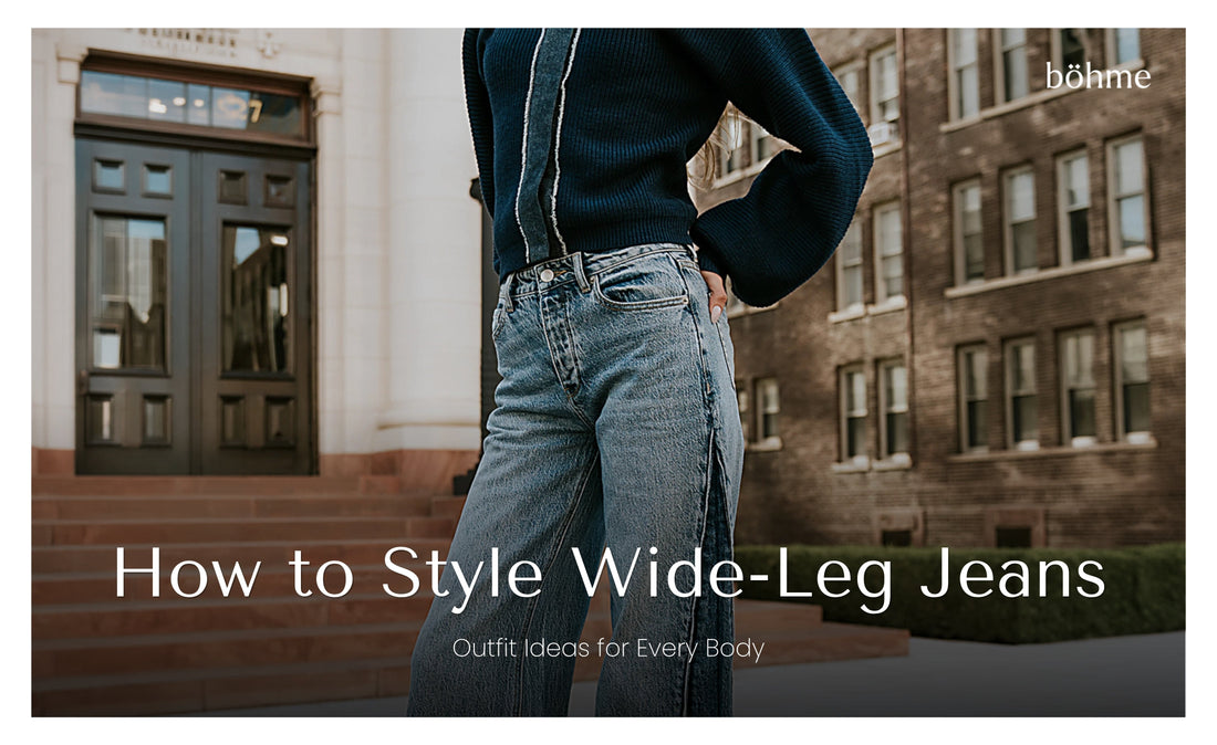 Close-up of wide-leg denim jeans styled with a navy sweater