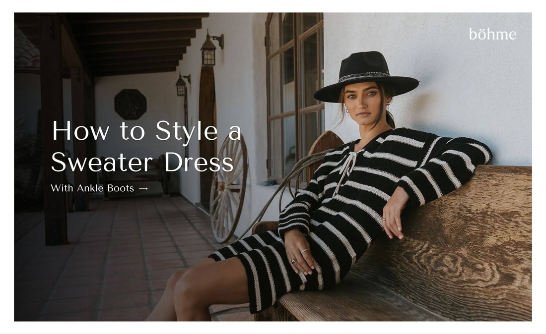 Woman wearing a black-and-white striped sweater dress with a wide-brim hat