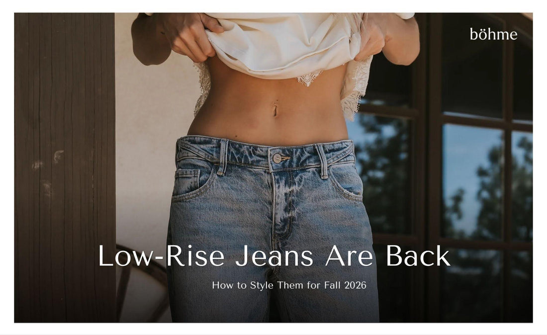 Woman wearing low-rise blue jeans with a white cropped lace-trim top.