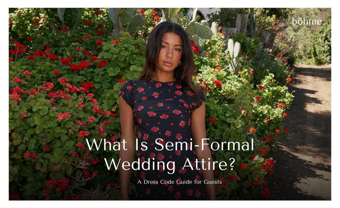 Woman wearing a black floral dress with red flowers, suitable for semi-formal wedding attire
