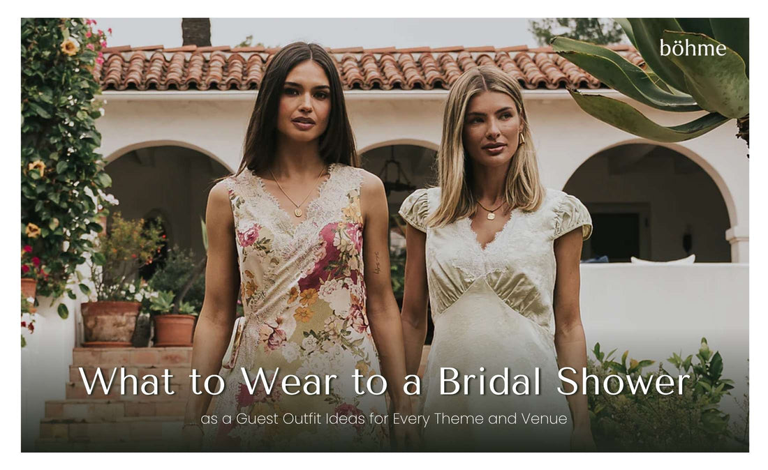 Two women in floral midi dresses standing outside a white arched building
