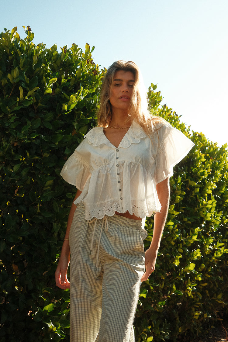 Ruffled hem top in white 