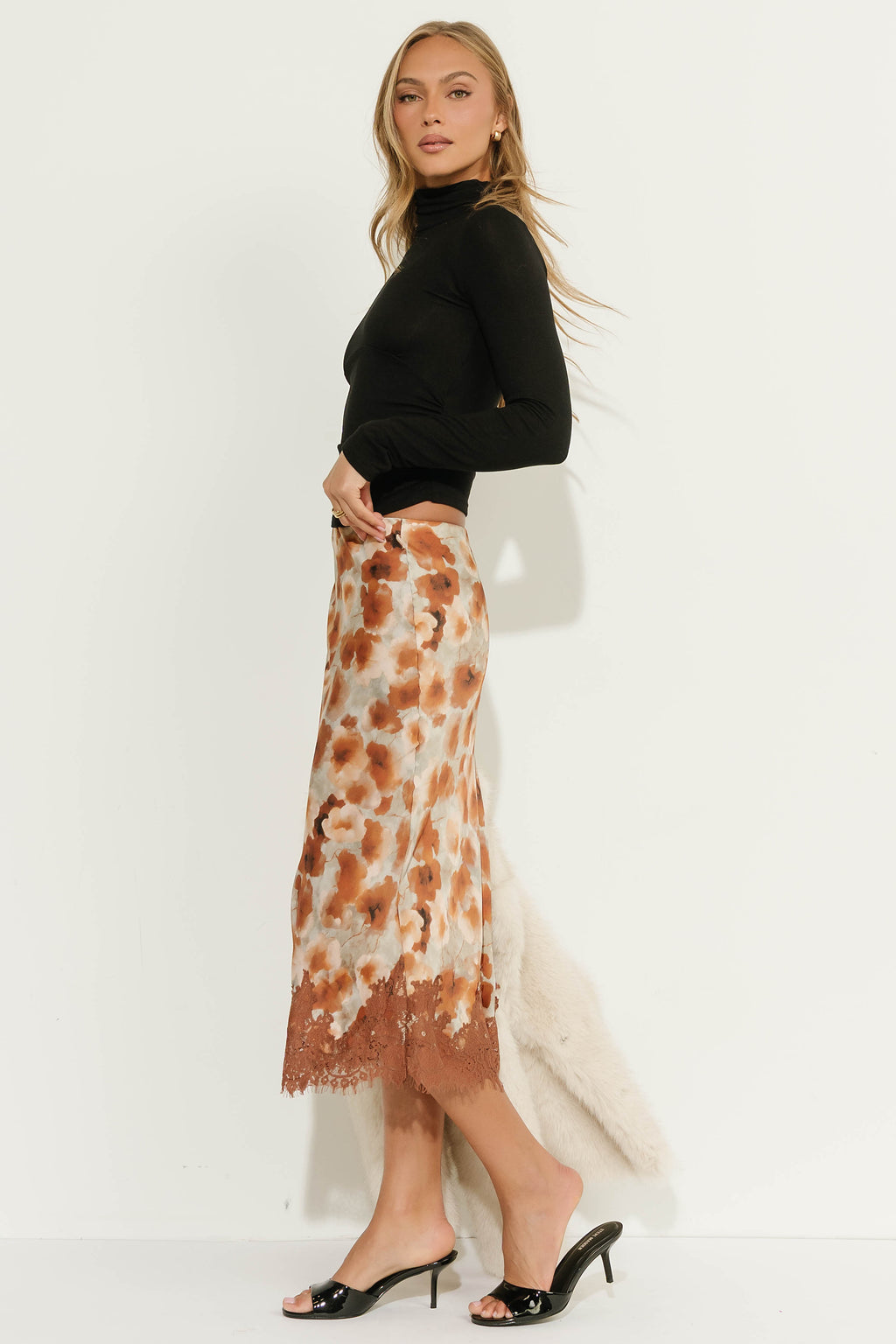 Anahi Ruched Turtle Neck Top in Black