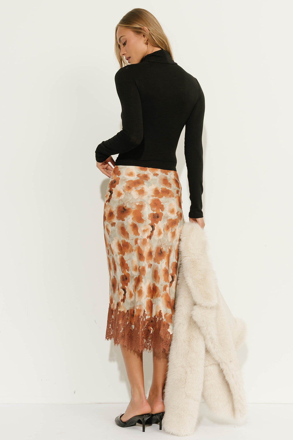 Anahi Ruched Turtle Neck Top in Black