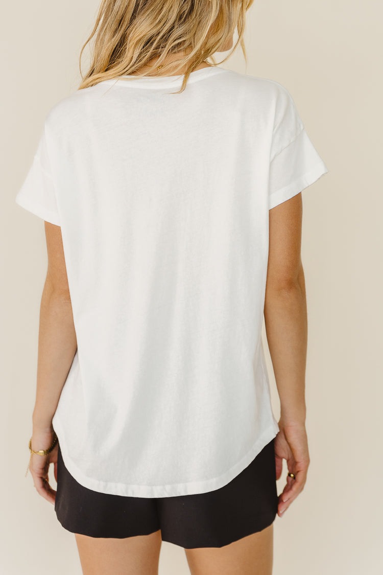 back view of white graphic tee