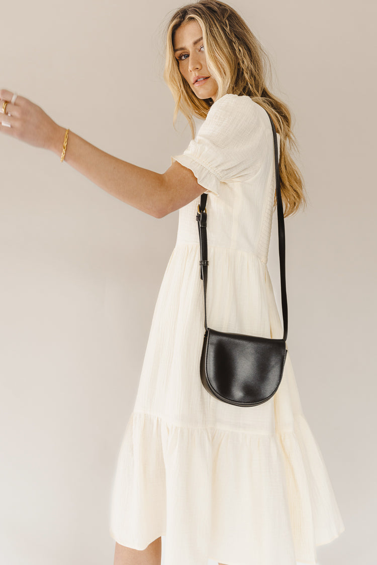 midi dress with black handbag