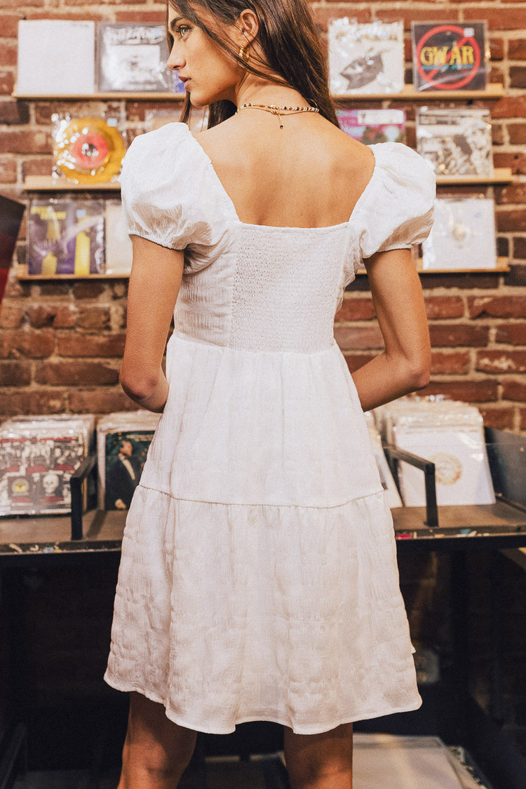 back view of white mini dress
