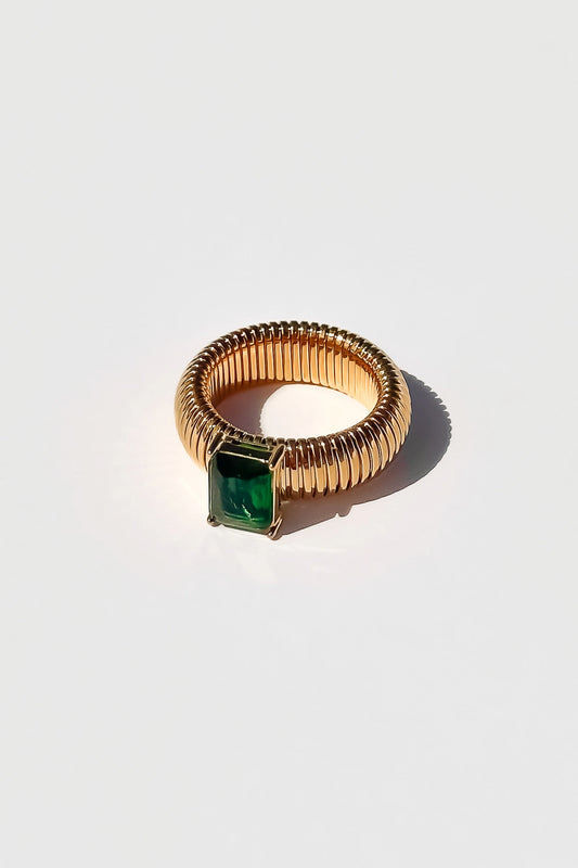gold textured with green gem 