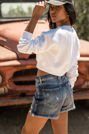 jeans shorts with light distressing on pocket