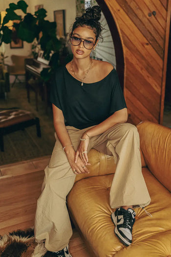 Parachute pants in khaki paired with a black top 