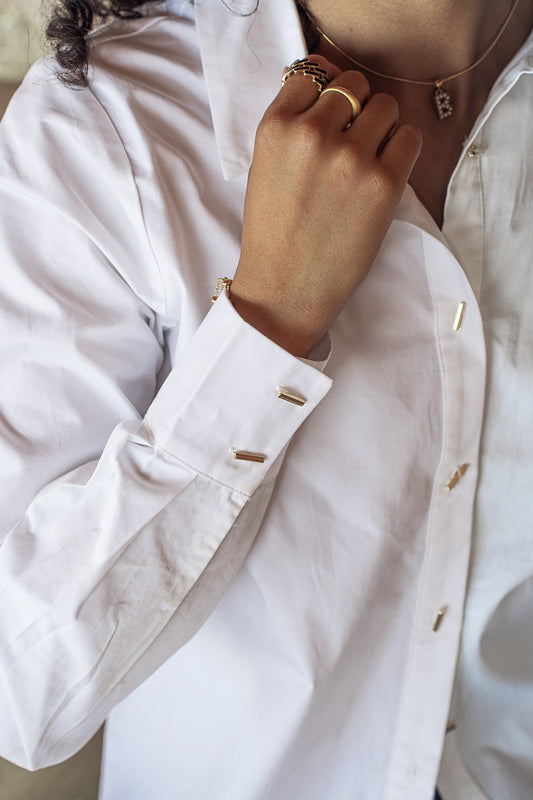 white button up with gold buttons