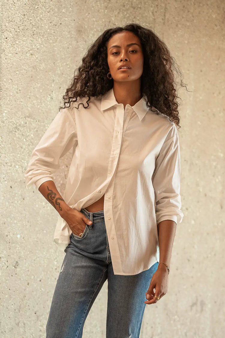 Button up in white paired with a denim 