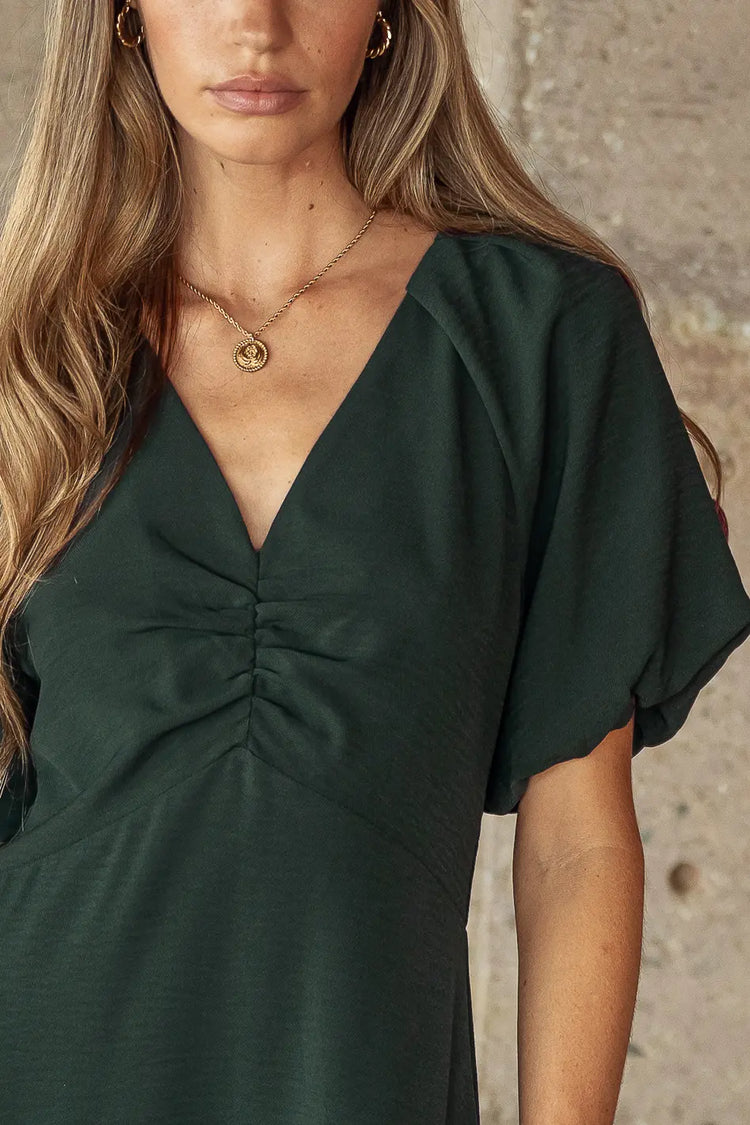 emerald green dress with v-neck