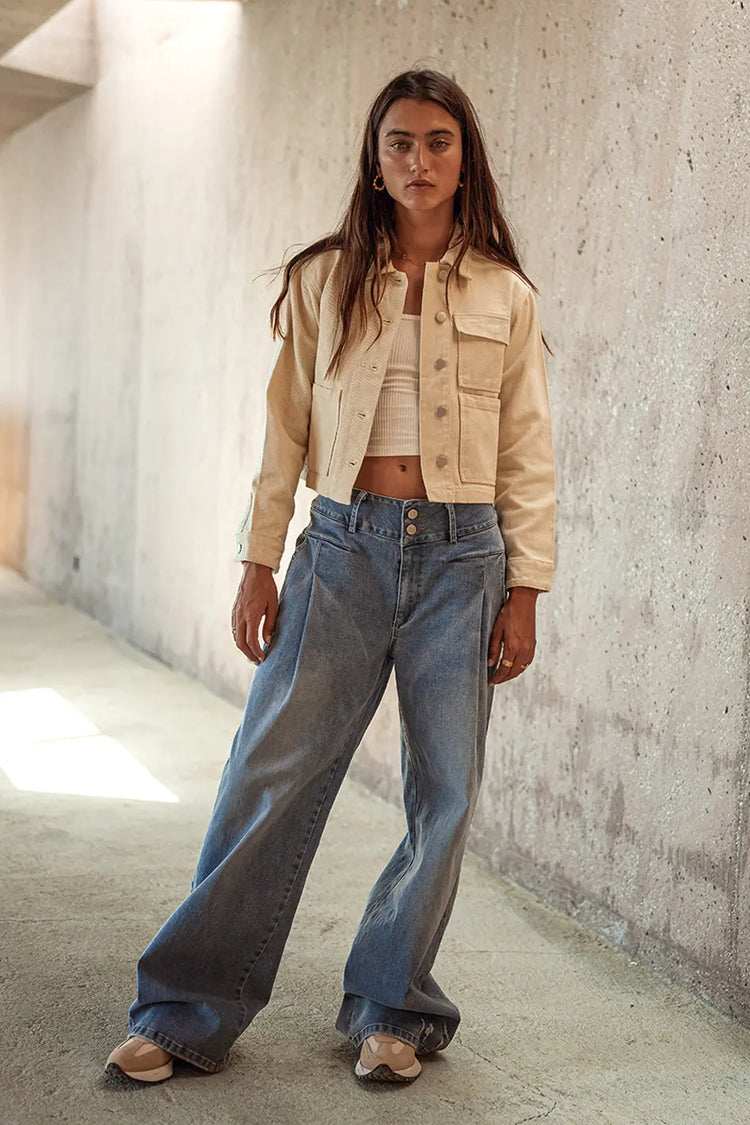 Cropped jacket in cream matched with denim jeans 