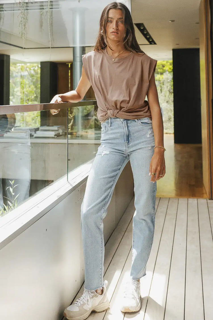 Top in taupe paired with a straight leg denim 