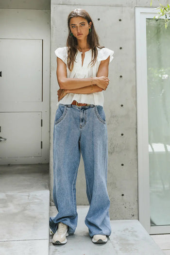 white blouse with flutter sleeves