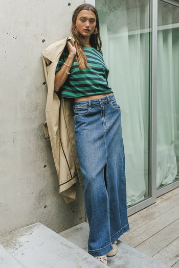 Striped cropped top paired with a denim skirt 