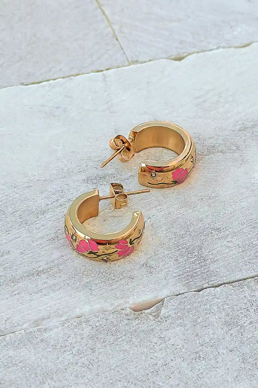 tiny gold earrings with pink floral detail 