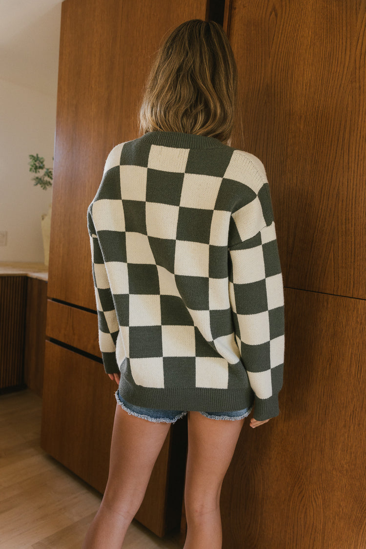 olive and white checker sweater