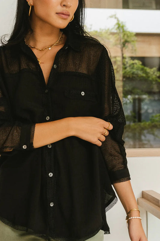 sliver buttons on black button up top 