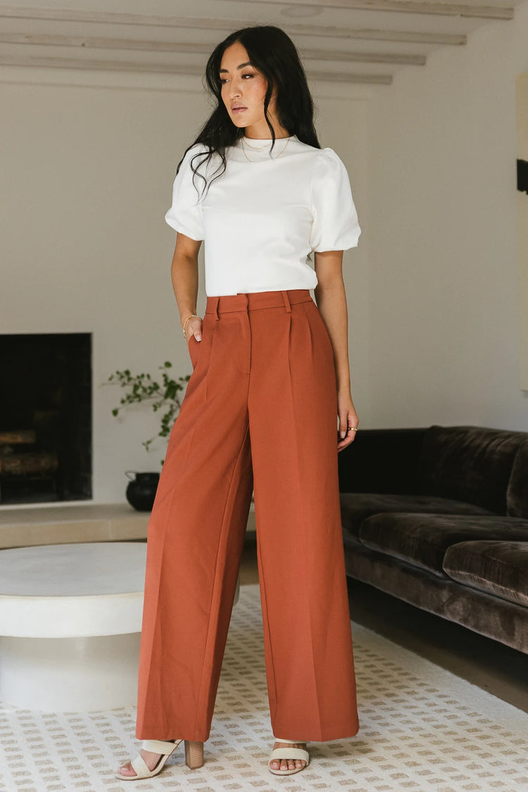 Wide leg pants paired with a white top 