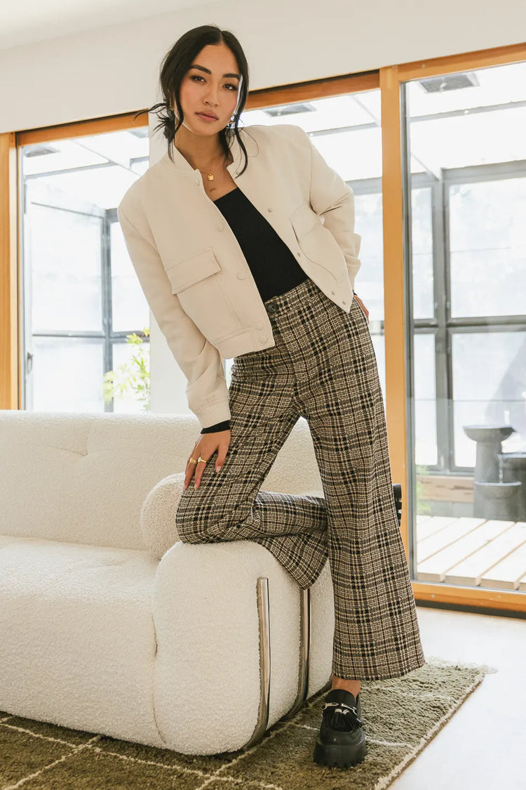 Jacket in cream paired with a plaid pants 