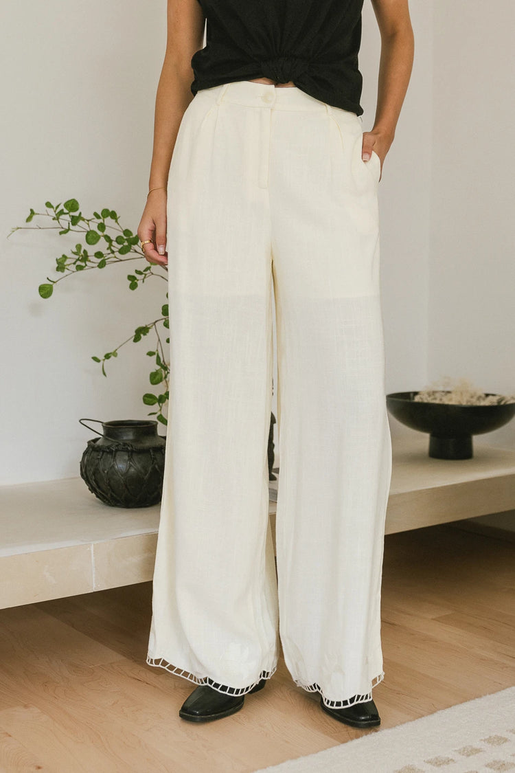 Embroidered hem pants in cream 