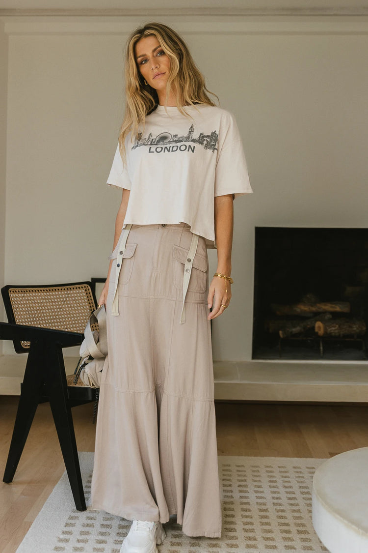 Cropped graphic tee paired with a maxi skirt 