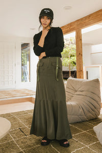 Maxi skirt in olive paired with a cropped long sleeve top 