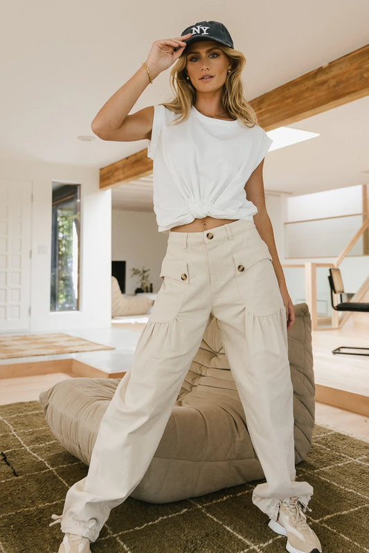 Wide legs pants in cream paired wit a white top 