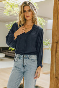 Woven blouse paired with a light denim 
