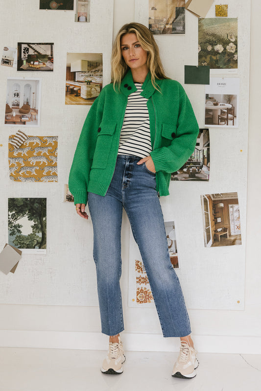 green cardigan with two front pockets
