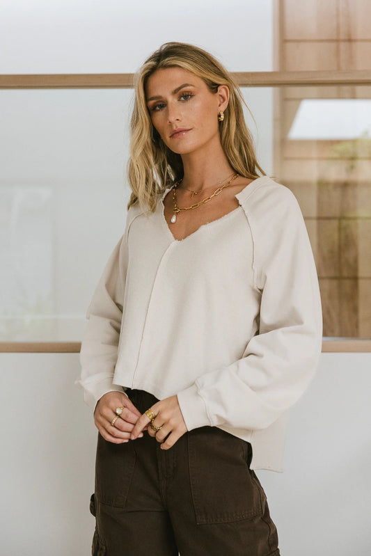 Sweatshirt in natural paired with a brown cargo pants 
