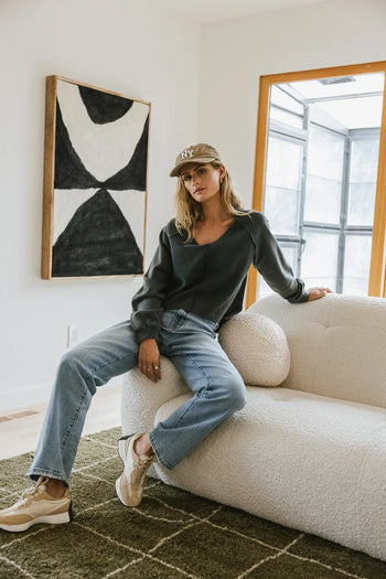 Sweatshirt paired with a light denim jean 