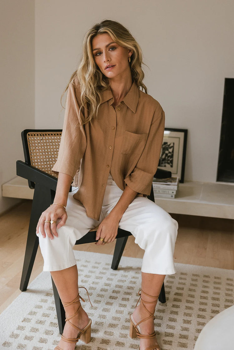 Button up in camel paired with a white denim 